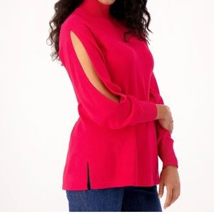 Cotton sweater with sleeve slits on each side. Size Small. Never worn.